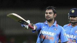 Indian batsman Virat Kohli celebrates his century with teammate Suresh Raina in their one day international cricket match against Sri Lanka in Hobart, Australia - 28 February 2012