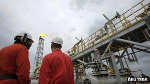 Workers talk at the Cidade Angra dos Reis offshore platform, 300km off the coast of Rio