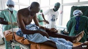 Nkwanta, GHANA: A Ghanaian doctor prepares a patient for an operation 02 June 2005 at the Wa hospital, northern Ghana