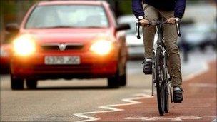 Generic pic of car and bike sharing the road