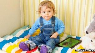 Toddler with an iPad