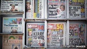 Selection of Sunday newspapers on a newsstand