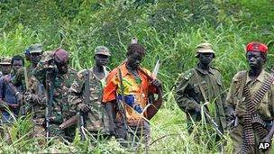 File picture taken in 2006 of members of Uganda's Lord's Resistance Army as their leader Joseph Kony meets with a delegation of Ugandan officials and lawmakers and NGO representatives in DR Congo near the Sudanese border