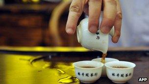 Tea being poured in a tea shop in Hong Kong