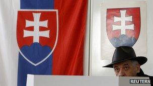 Man prepares to cast vote in Slovak poll