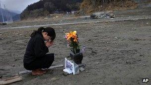 Survivor Mika Hashikai mourns her father, killed in the tsunami in Rikuzentakata (photo: 11 March 2012)