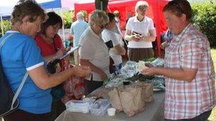 Customers at Garden Village market