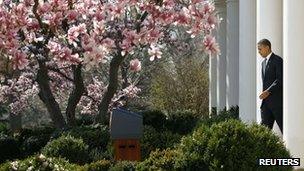 Mr Obama moves towards a podium in the White House Rose Garden 13 March 2012