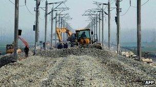 Work continues along a section of Hanyi High Speed Railway near Qianjiang in central China's Hubei province, 12 March 2012