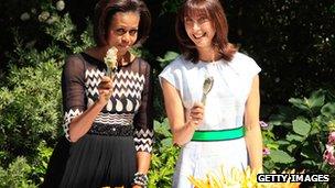 Michelle Obama and Samantha Cameron serve food in the Downing Street garden in 2011