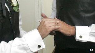 Two men exchanging rings