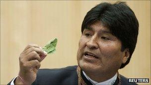 Bolivian President Evo Morales holds a coca lead as he addresses the UN drugs commission in Vienna, 12 March