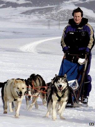 David Cameron on glacier with dogs