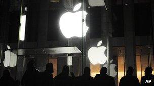 Customers outside an Apple store in Manhattan, New York