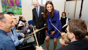 Richard and Joshua Margereson (left) enjoy music with the Duchess of Cambridge at EACH, Ipswich