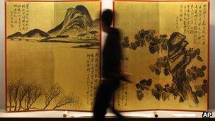 A rare pair of gold screens by Chinese artist Qi Baishi at a Sothebys auction preview