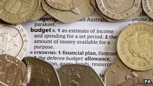 Coins surrounding dictionary entry for the term budget