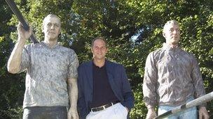 Rower Steve Redgrave standing beside his statue in Henley