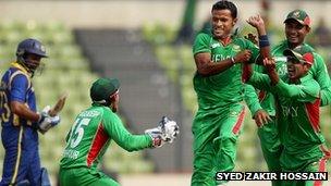 Bangladeshi cricketers celebrate victory over India