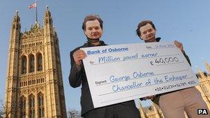 Protesters highlight Chancellor George Osborne's reduction in income tax for high earners