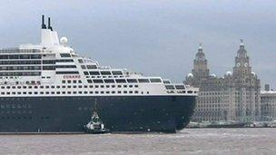 Cruise liner passing Liverpool's historic waterfront