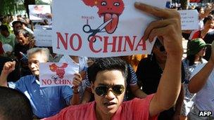 Vietnamese protesters shout anti-China slogans during a rally in the centre of Hanoi on 14 August 2011