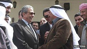 Amr Moussa (2nd left) is greeted by Bedouins during his campaign tour