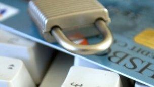 Padlock on top of credit card and keyboard