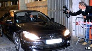 Dominique Strauss-Kahn leaves in the back of a car after being heard by judges on 26 March, 2012 Lille