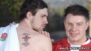 John Adam shows his Wales tattoo with friend James Griffiths