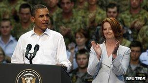 US President Barack Obama speaking to US Marines and Australian troops at the RAAF Base as Australian Prime Minister Julia Gillard listens, in Darwin, on 17 November, 2011