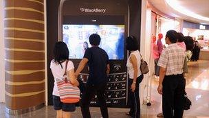 Shoppers are drawn to the large interactive display of the popular mobile handset Blackberry