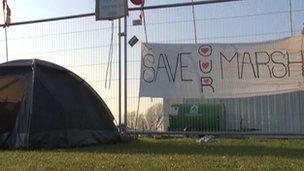 A tent and campaign poster