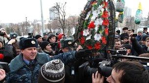 Policemen argue with demonstrators protesting against police brutality in the Russian city of Kazan on 15 March 2012