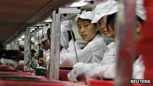 Workers are seen inside a Foxconn factory in the township of Longhua in the southern Guangdong province, in this file picture taken May 26, 2010