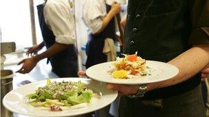 Waiter with plates of food