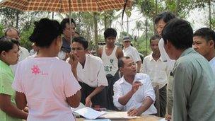 Election official Win Oo at work outside polling booth in Kawhmu