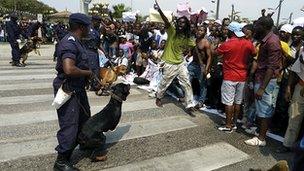 Police face protesters in Luanda