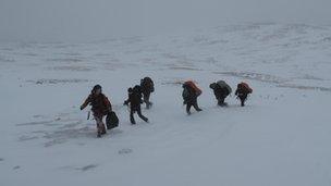 Climbers being led to rescue helicopter in the Ben Macdui area