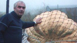 Clive Bevan with a giant pumpkin