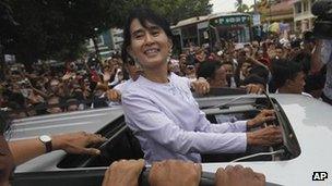 Aung San Suu Kyi surrounded by supporters in Rangoon on 2 April 2012