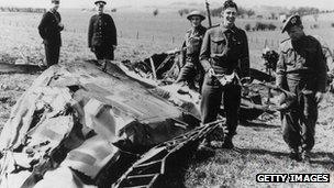 Soldiers looking at the wreck of Hess' plane