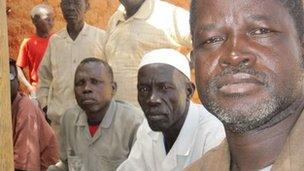 South Sudanese men, including chief Carlo Musa