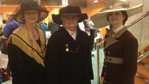 Three women dressed in vintage clothing