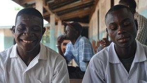 Two young men in school, Bong County, Liberia, 9 April 2012