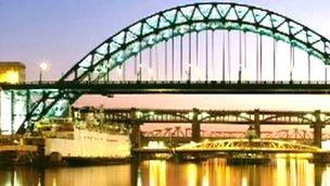 Tyne Bridge at night with Tuxedo Princess moored beneath, on a Royal Mail stamp