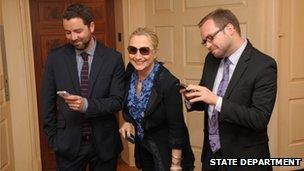 Adam Smith and Stacy Lambe with Mrs Clinton at the State Department