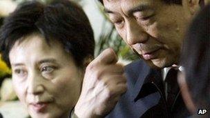 Chongqing Communist Party Secretary Bo Xilai, right, accompanied by his wife Gu Kailai