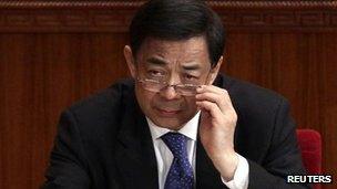 Bo Xilai adjusts his glasses during the opening ceremony of the Chinese People's Political Consultative Conference (CPPCC) in Beijing, 3 March 2012