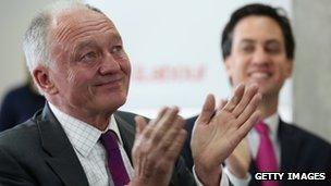 Ken Livingstone (L), the Labour candidate for Mayor of London, applauds with tears in his eyes as he views his mayoral promotional video with Labour leader Ed Miliband